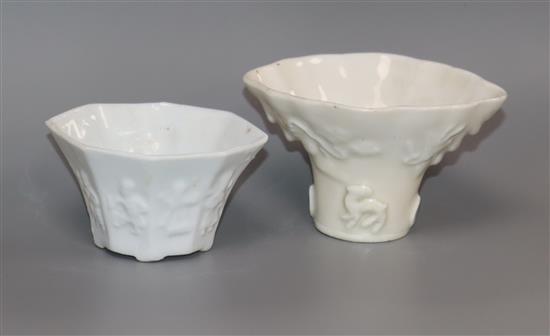 Two Chinese blanc de chine libation cups, decorated with eight figures and animals, 18th / 19th century